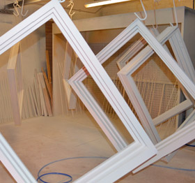 Window frames hanging in our factory finishing facility